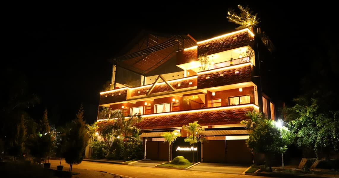 Mountain Nest Villa exterior with hills